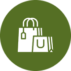 Shopping bags icon on green circle